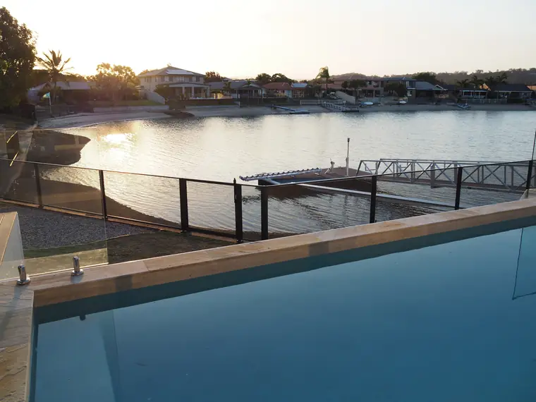 The pool above the canal, the fence along the water’s edge.
