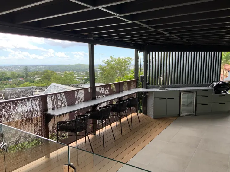 An outdoor kitchen with Australiana panels in Core Ten and the city beyond.