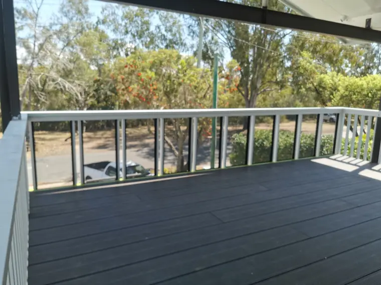 A plain balustrade around a composite deck.