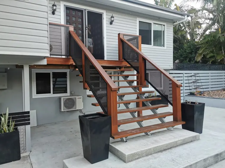 Front stairs with plain panels between the timber.