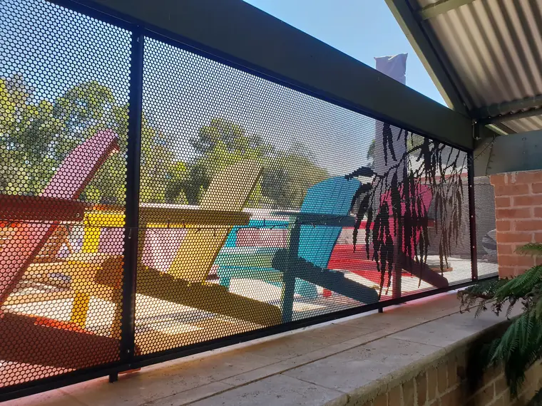 Gum Perf on a verandah, the colours of the chairs showing through.