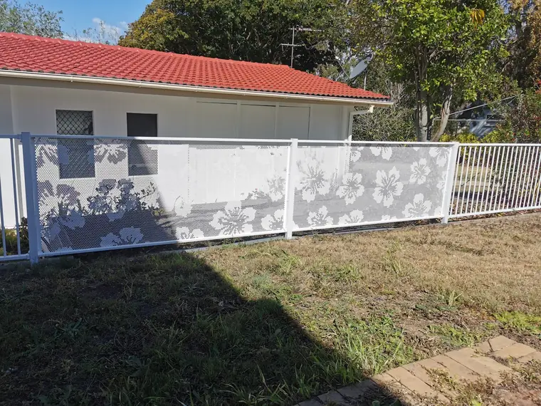 Hibiscus panels along the top of a retaining wall.
