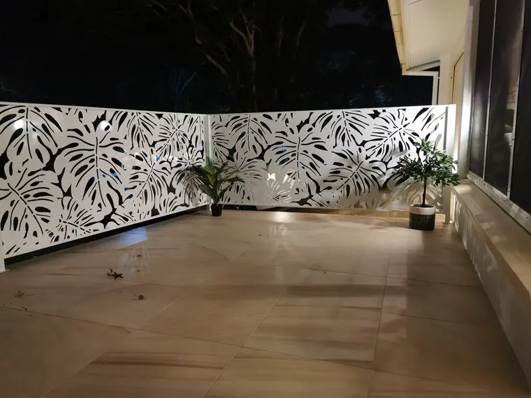 The same terrace from the inside, at night.