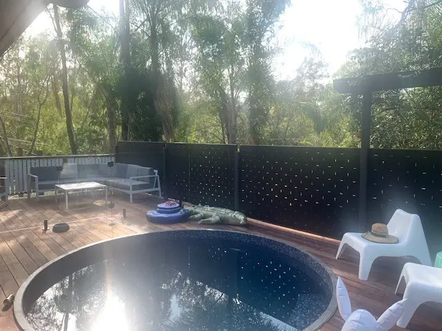 A custom design screening a deck with a plunge pool.
