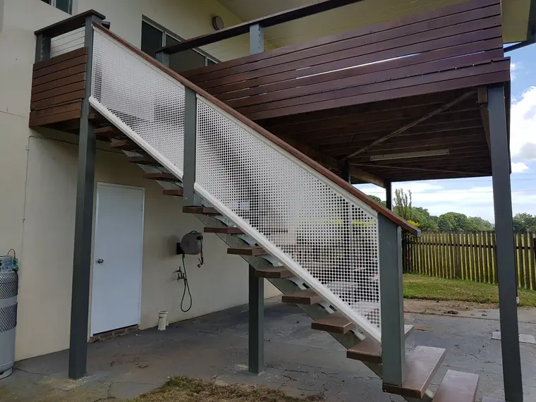 Panels cut on an angle to follow a stair up to a deck.