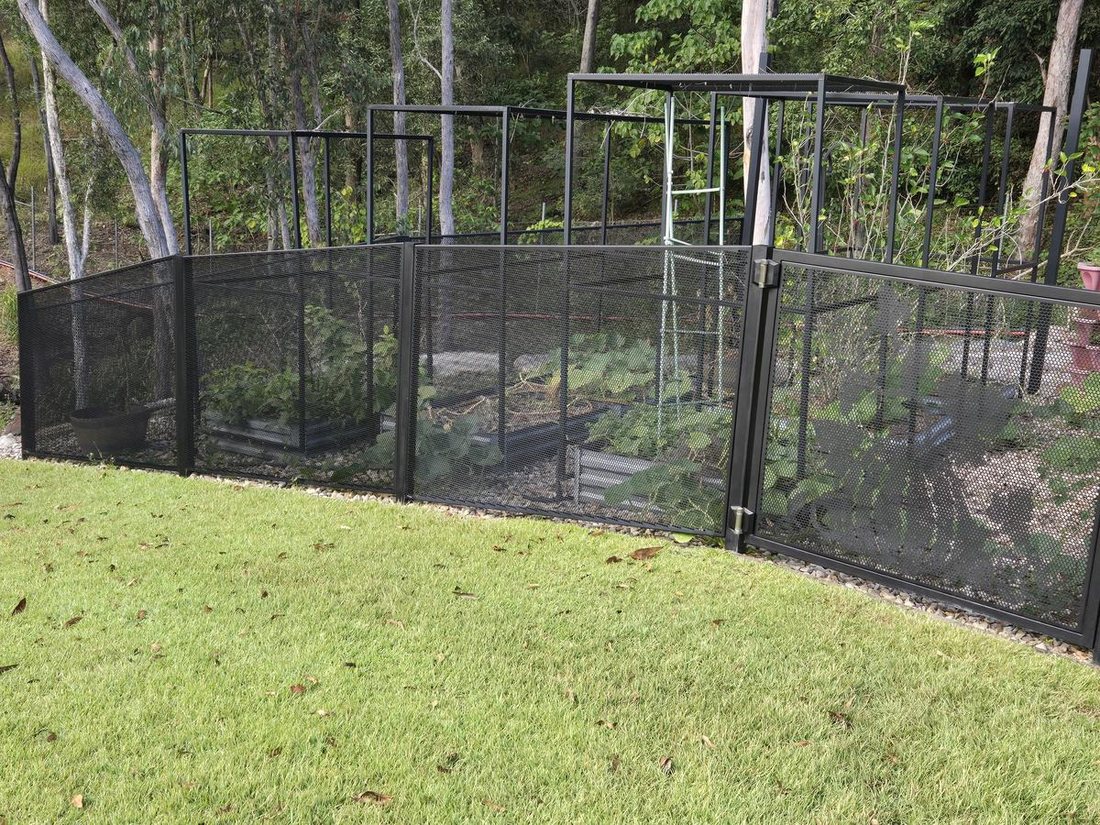 The same Pool Perf fence fully restored to deep black after cleaning