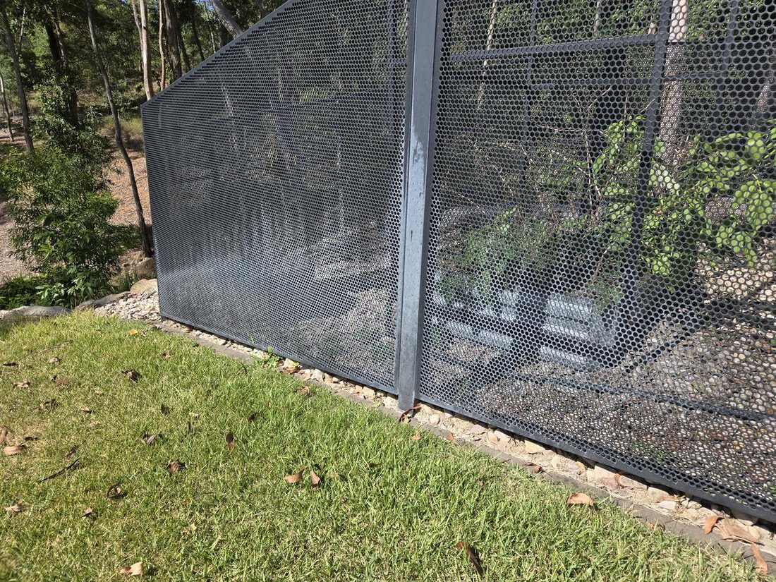 Pool Perf fence with white chalky mineral deposits from bore water irrigation