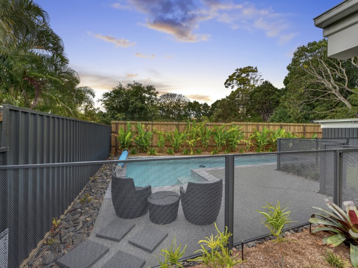 Pool Perf fencing installed on sloping ground with raked panels